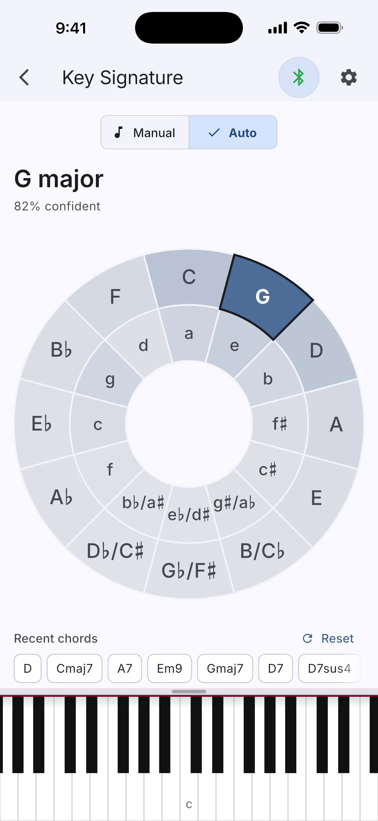 WhatChord showing automatic key detection in G major with 82 percent confidence, a circle-of-fifths likelihood wheel, recent chords, and the keyboard